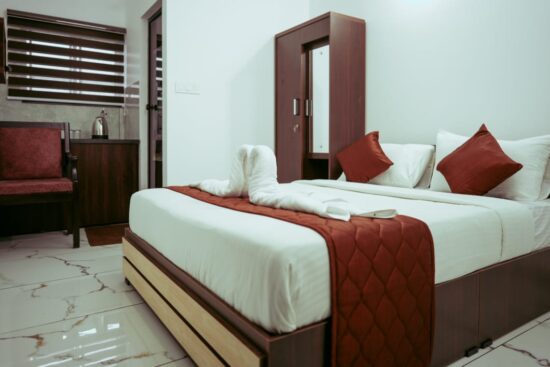Deluxe suite with king-size bed and city view at Hotel Gold Suite, near Infopark, Kochi. hotels near kakkanad infopark hotels in kakkanad ernakulam hotels in kakkanad rooms in kakkanad